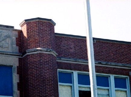 Class 1953 and their logo on high school building